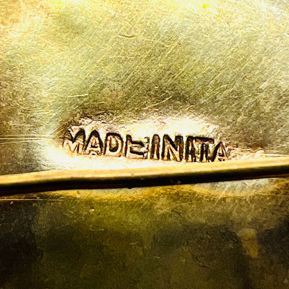 Close-up of the Made in Italy stamp on the gold-tone reverse of the vintage micro mosaic brooch.