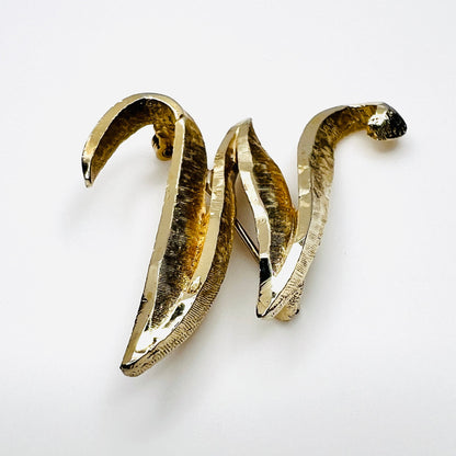 Side view of vintage Mamselle gold tone initial brooch showing dimensional construction