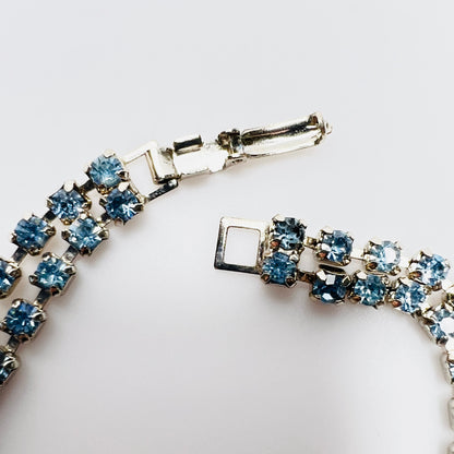 Fold over clasp detail on vintage double strand blue rhinestone bracelet