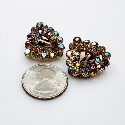 Signed Continental AB rhinestone clip-on earrings shown with quarter for scale.
