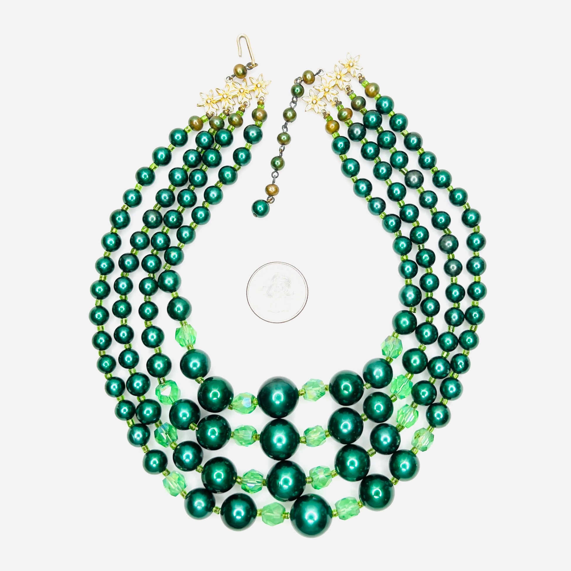 Vintage Japan necklace with emerald faux pearls and faceted crystal beads with quarter for scale