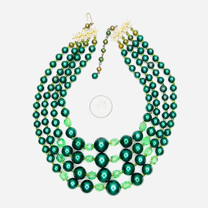 Vintage Japan necklace with emerald faux pearls and faceted crystal beads with quarter for scale