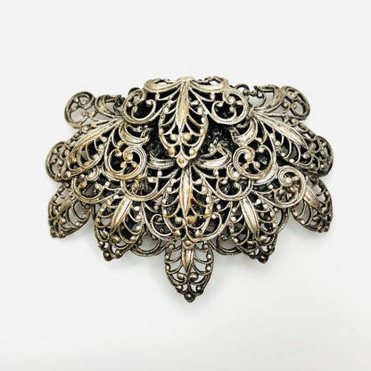 Vintage 1950s silver tone fleur-de-lis filigree brooch with ornate layered scrollwork