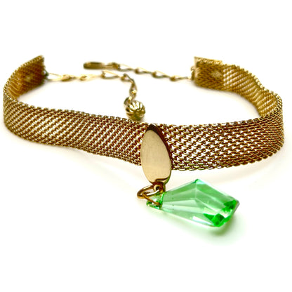 Close-up of vintage 1950s mesh choker necklace with green crystal drop and adjustable chain