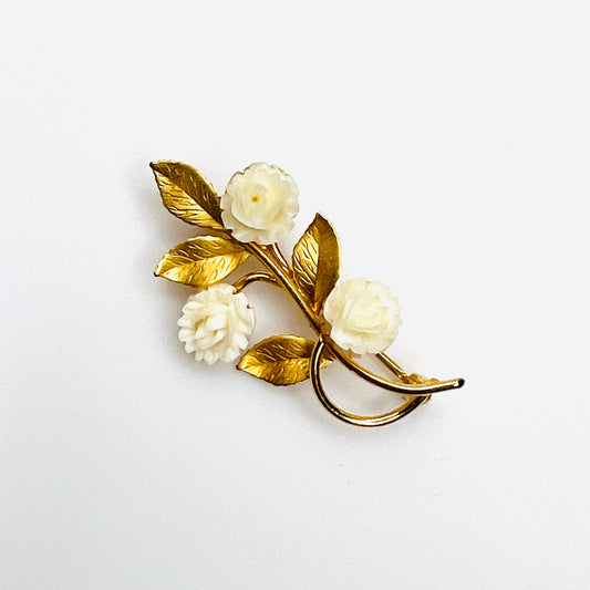 Vintage 14K gold floral brooch with three carved ivory coral roses and textured gold leaves