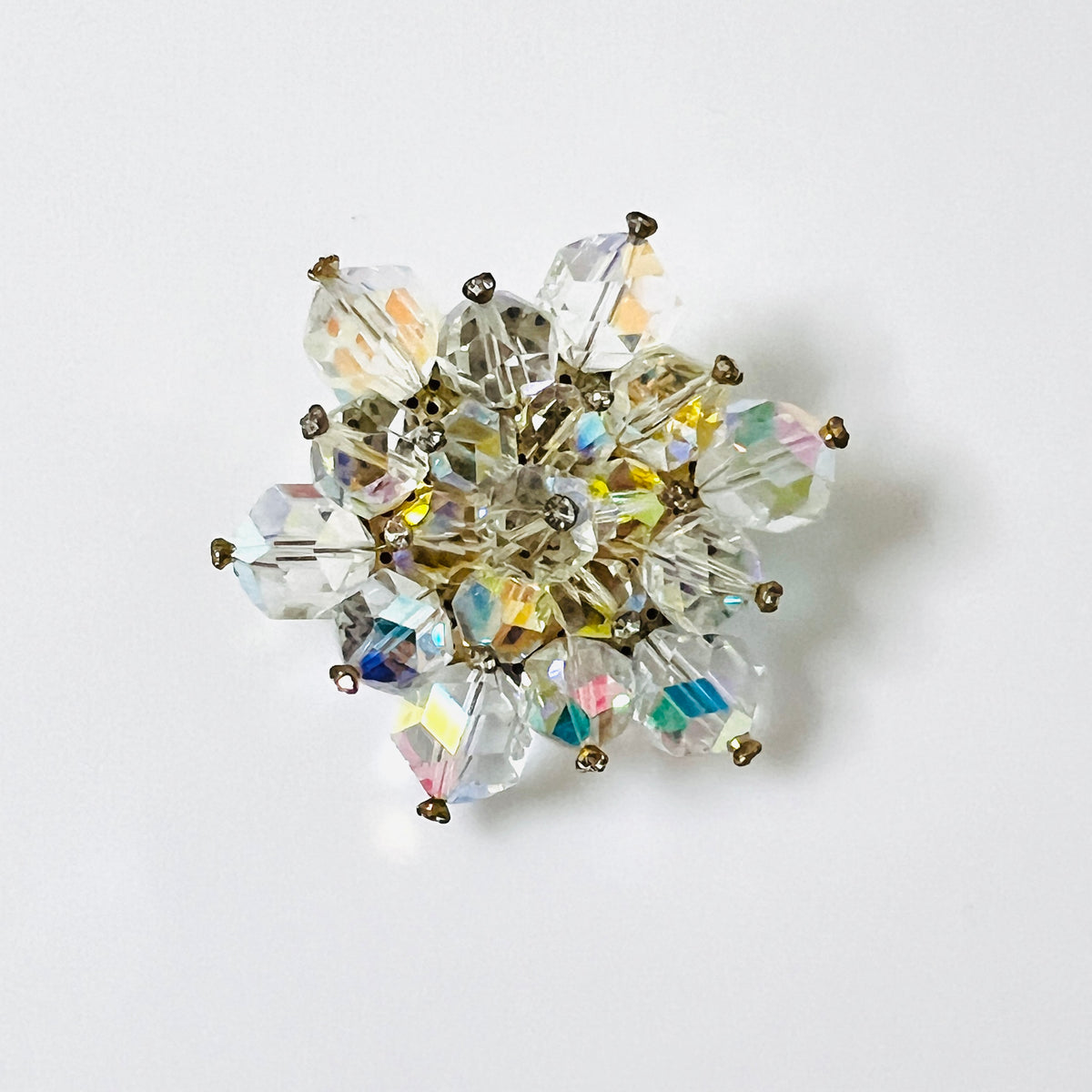 Vintage 1950s aurora borealis faceted crystal cluster brooch with clear rhinestone accents