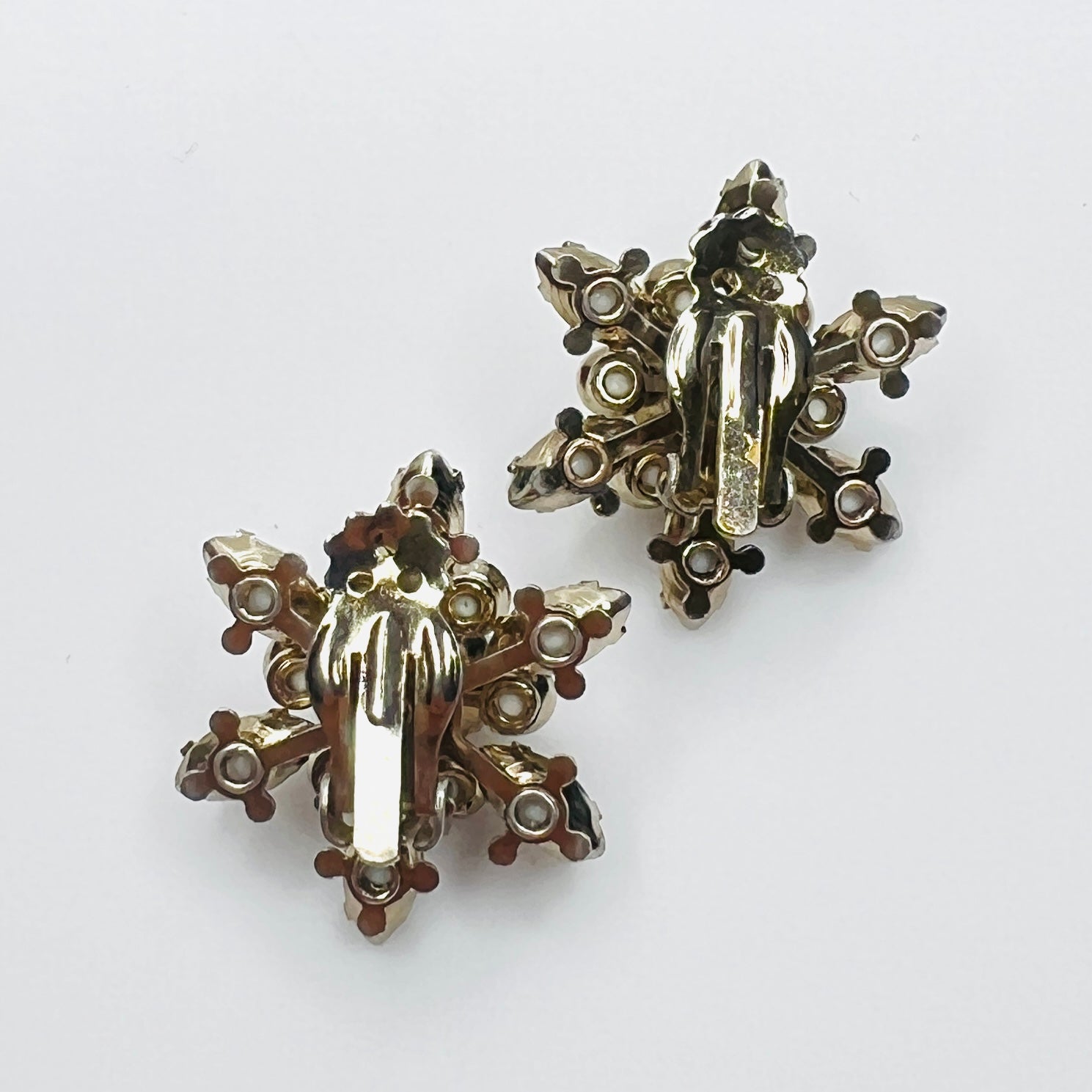 Back view of vintage white milk glass clip-on earrings.