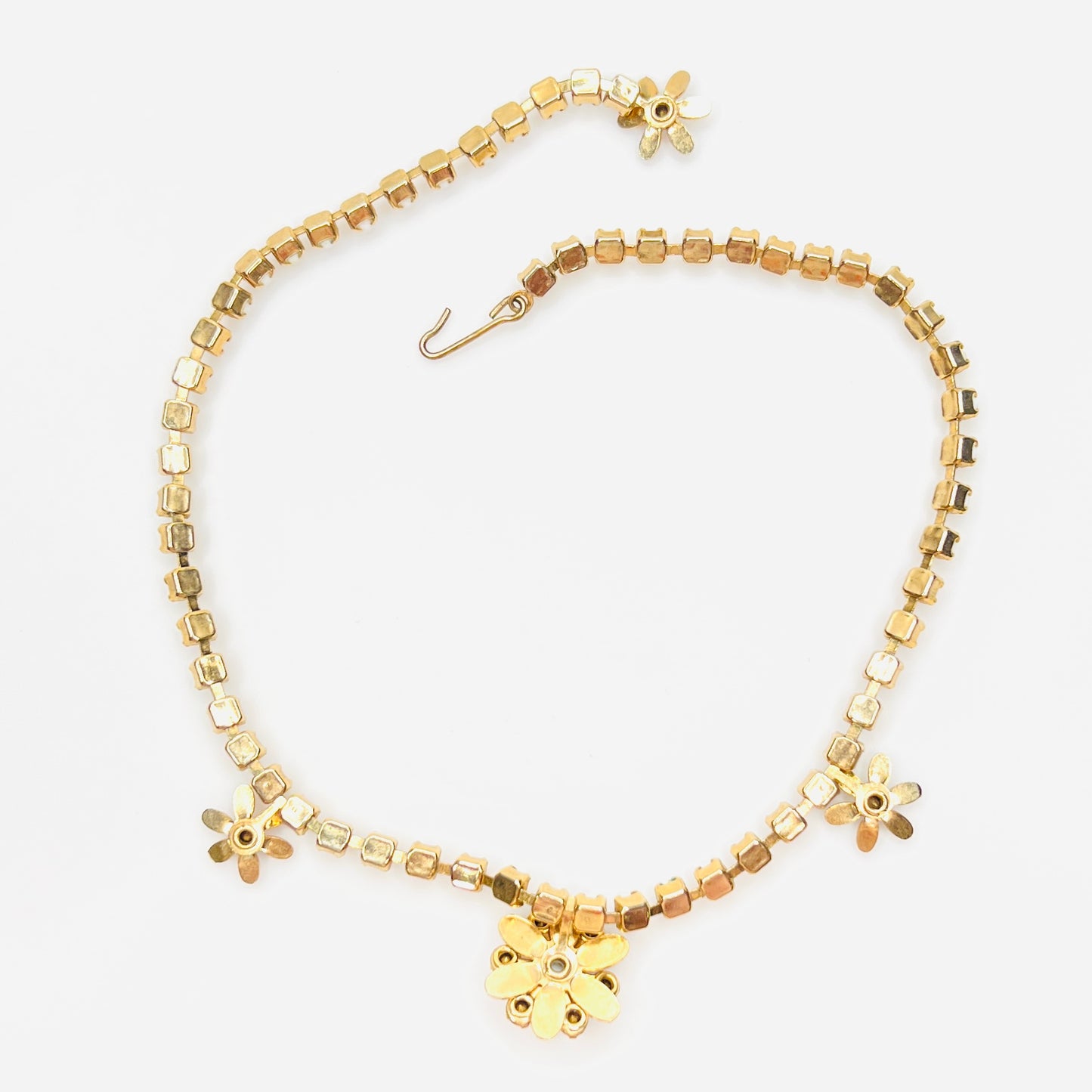 Back view of vintage milk glass and rhinestone floral choker necklace.