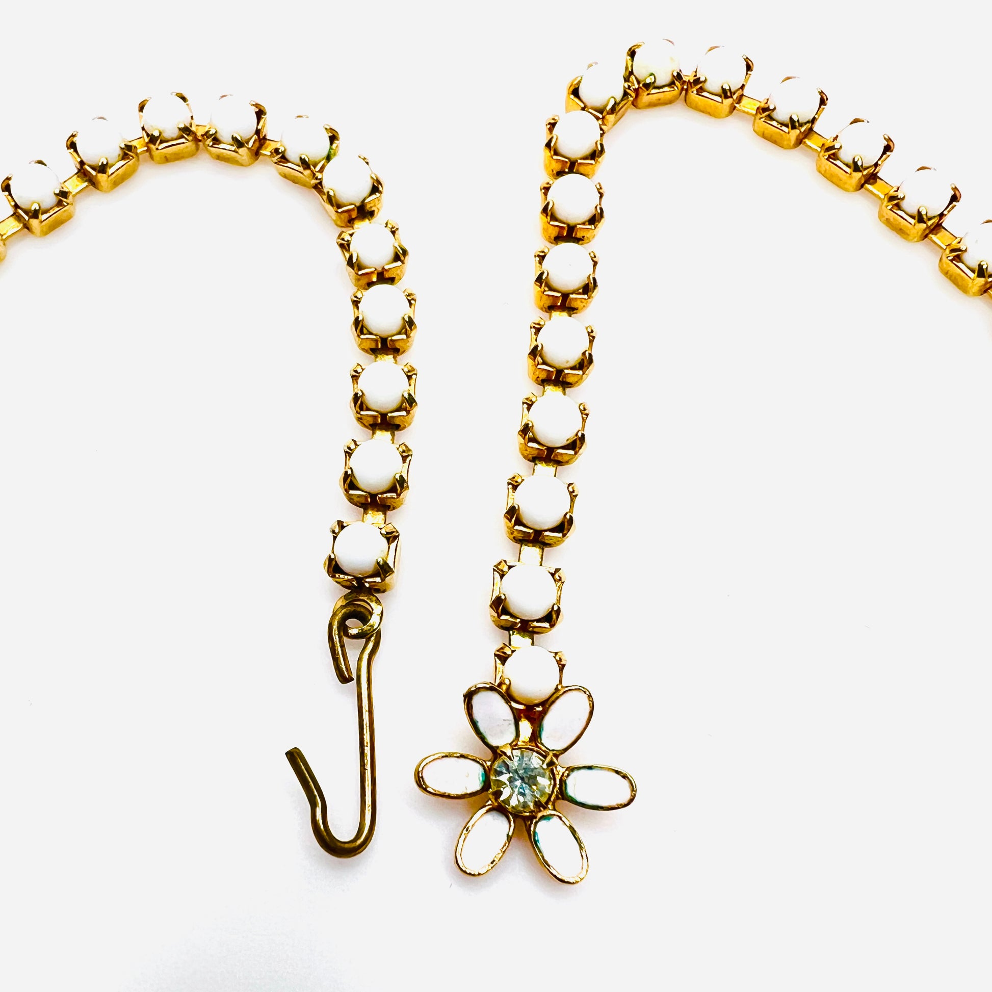 Adjustable hook clasp and floral detail on vintage milk glass choker.
