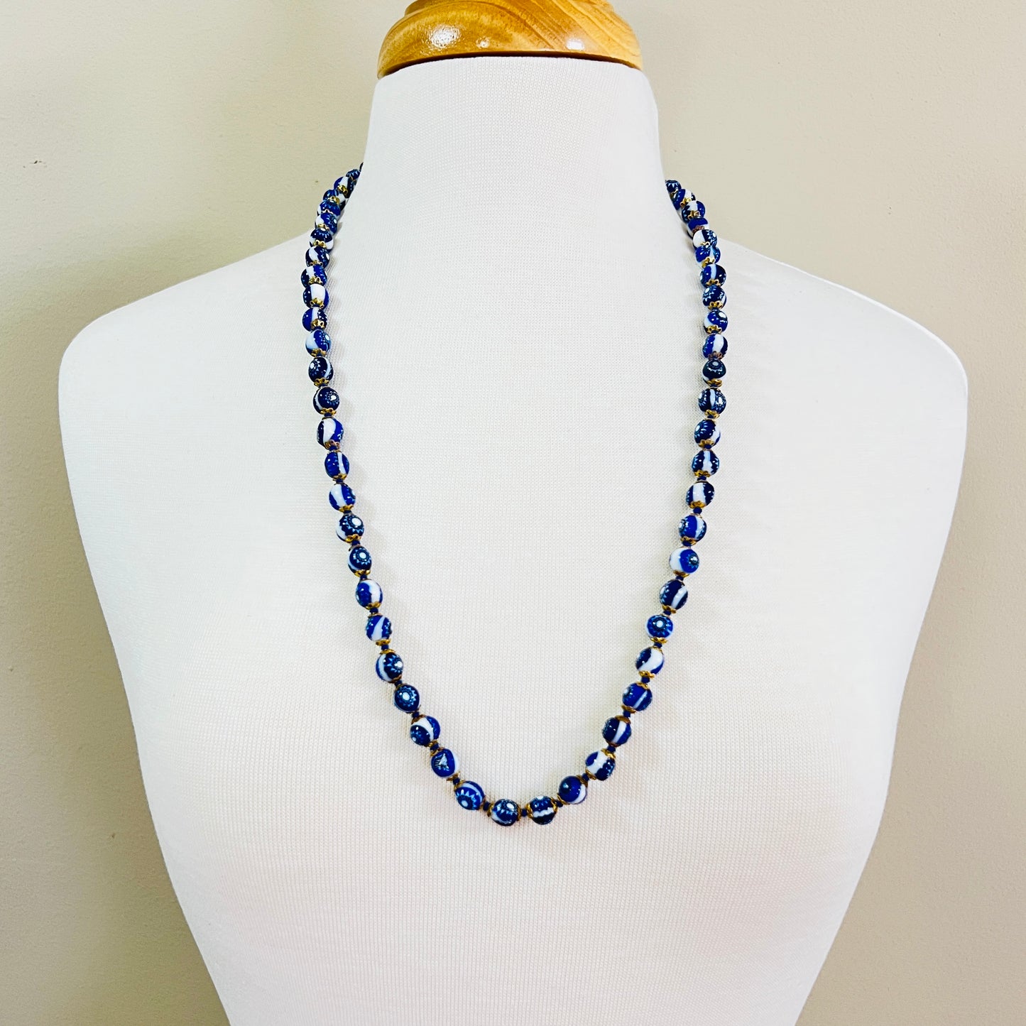 Cobalt blue Venetian glass necklace displayed on mannequin