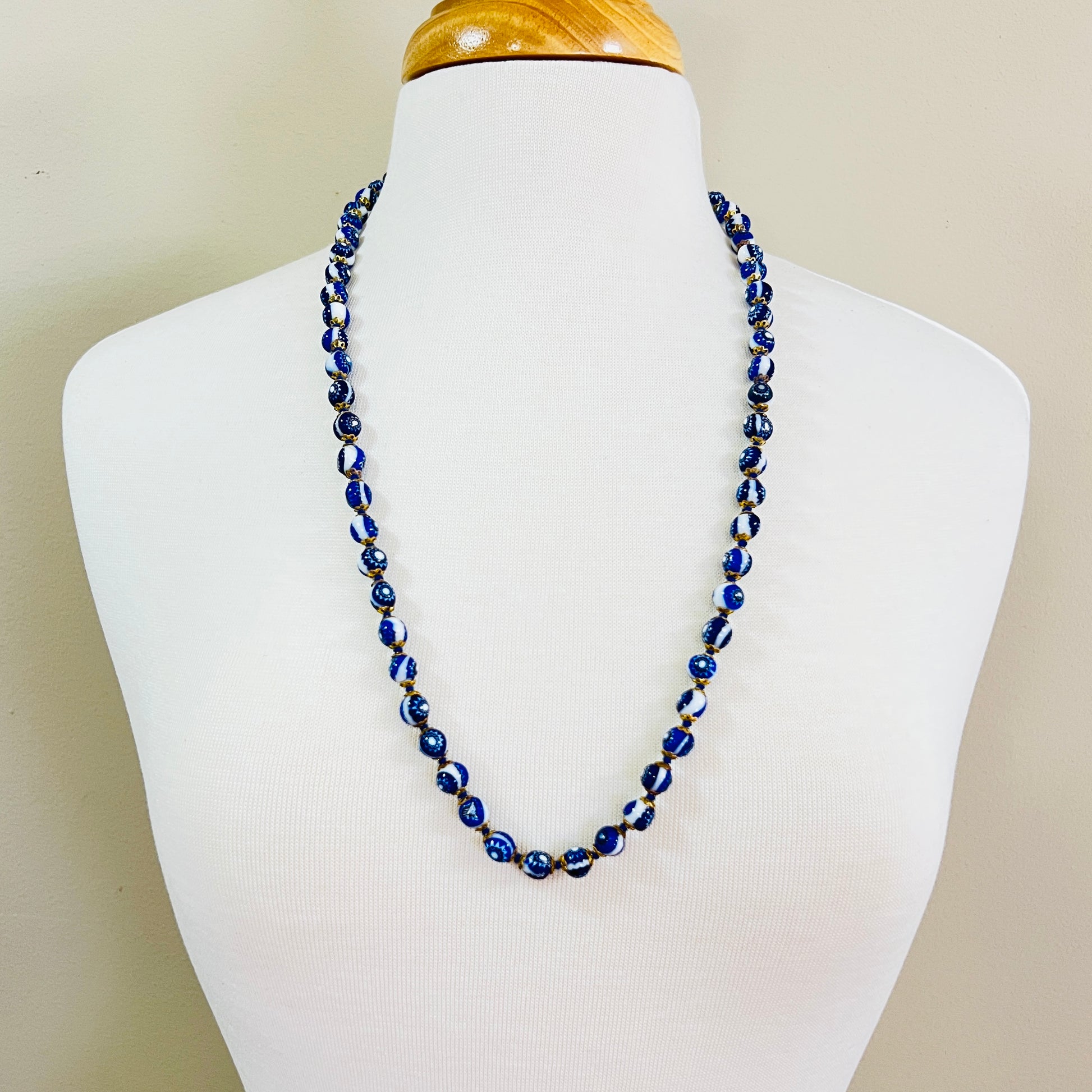 Cobalt blue Venetian glass necklace displayed on mannequin