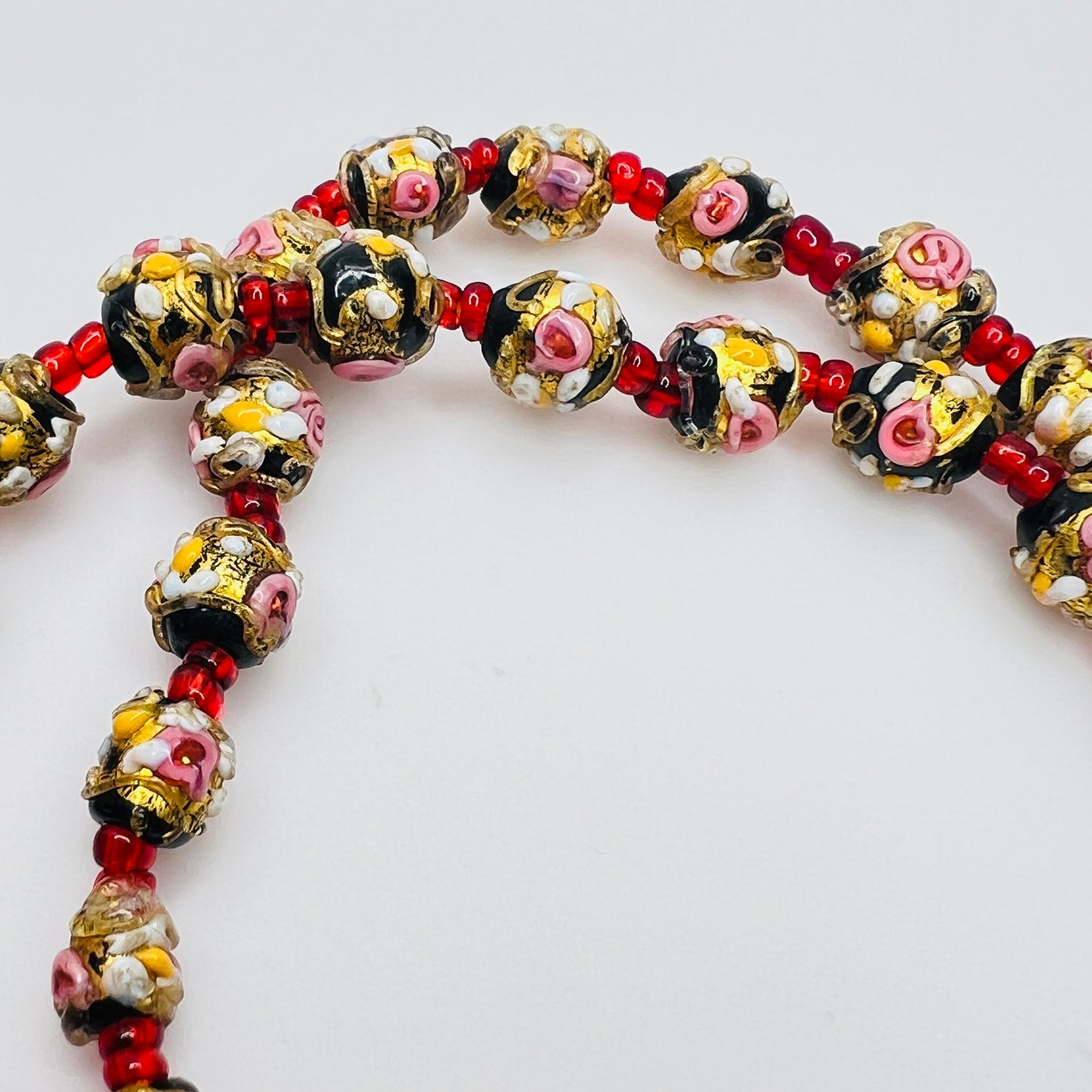 Detail of floral decorated Venetian glass beads