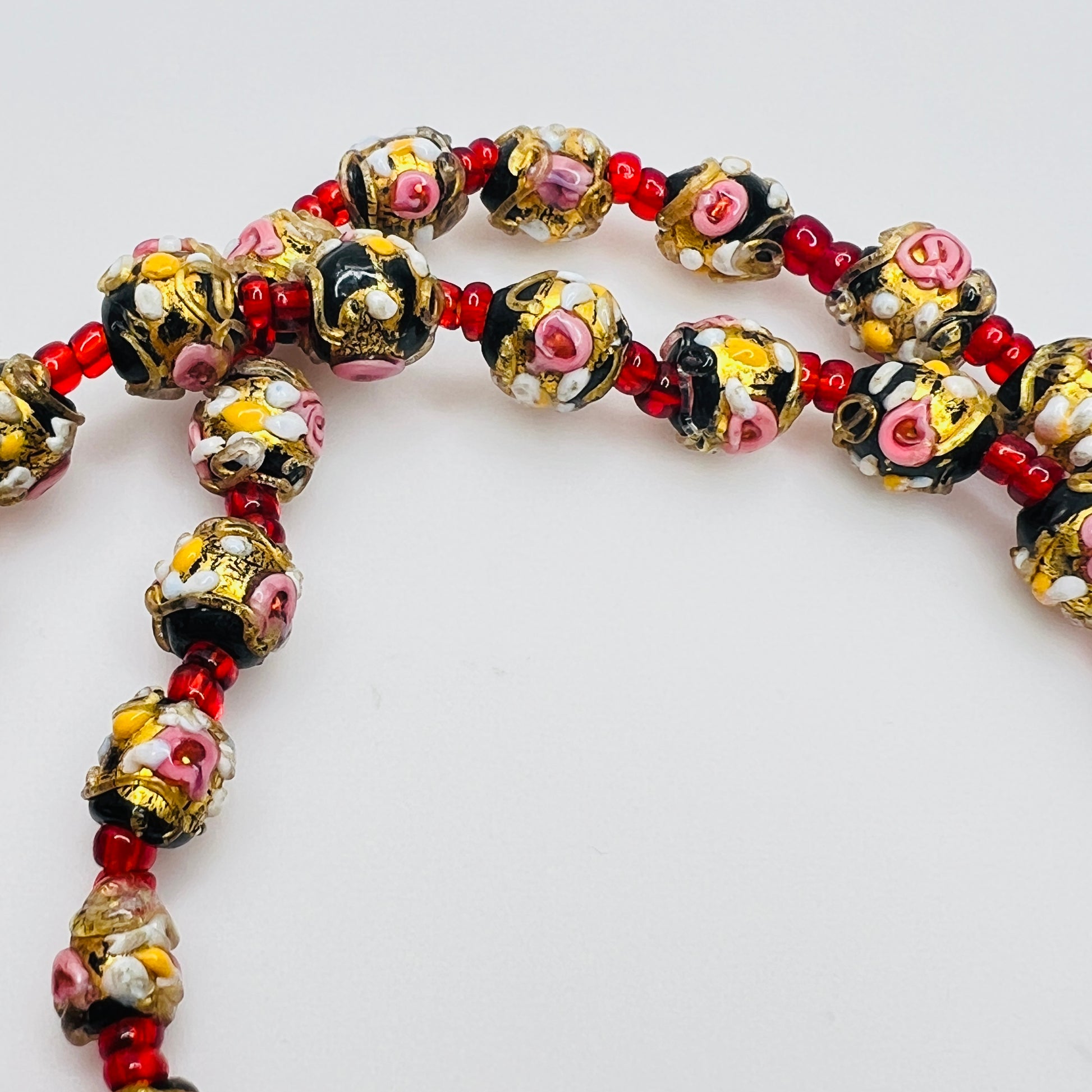 Detail of floral decorated Venetian glass beads