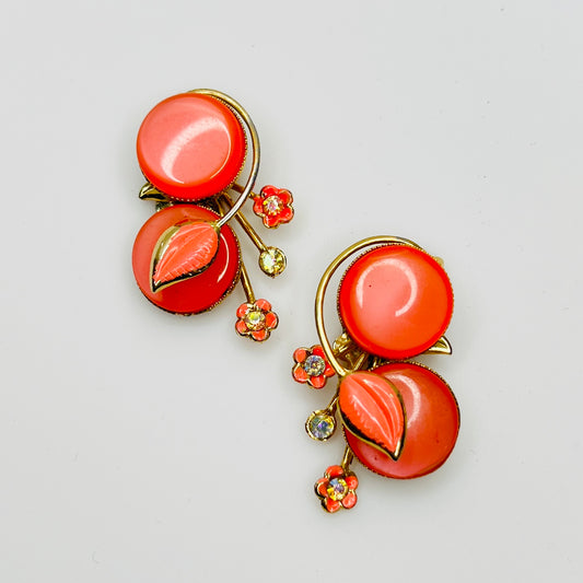 Vintage Coro orange moonglow clip on earrings enamel leaf rhinestone