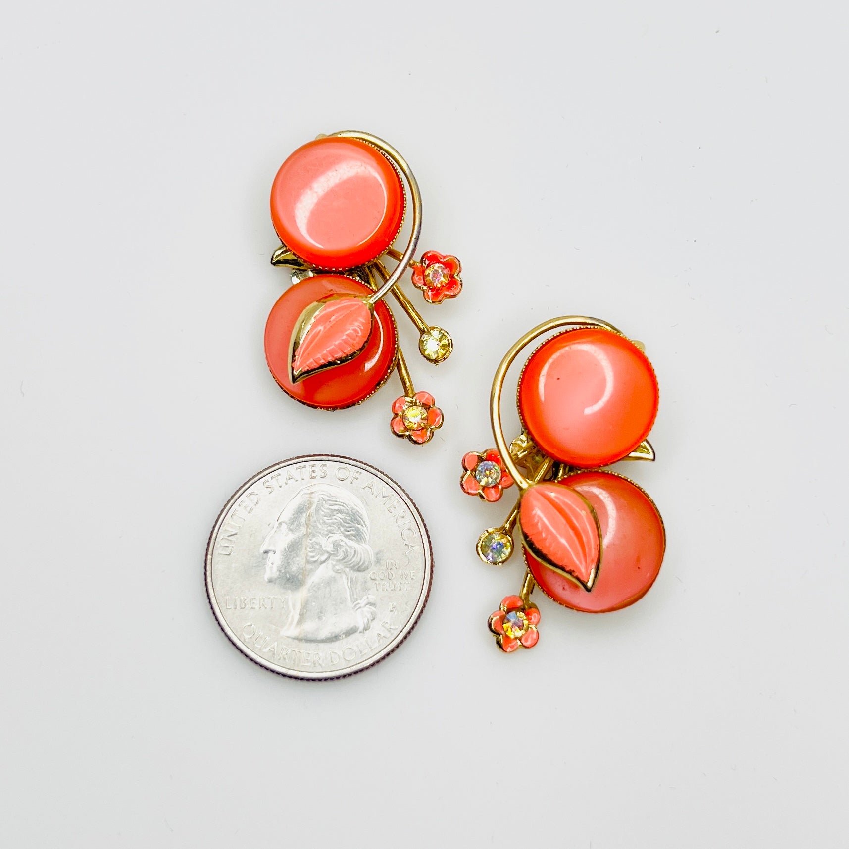 1950s Coro orange cabochon earrings with floral rhinestone detail size