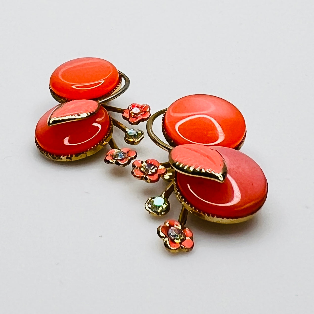 Side view orange enamel moonglow earrings gold tone vintage Coro