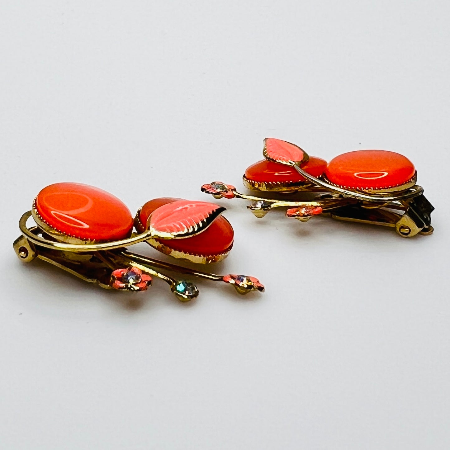 Side view orange enamel moonglow earrings gold tone vintage Coro