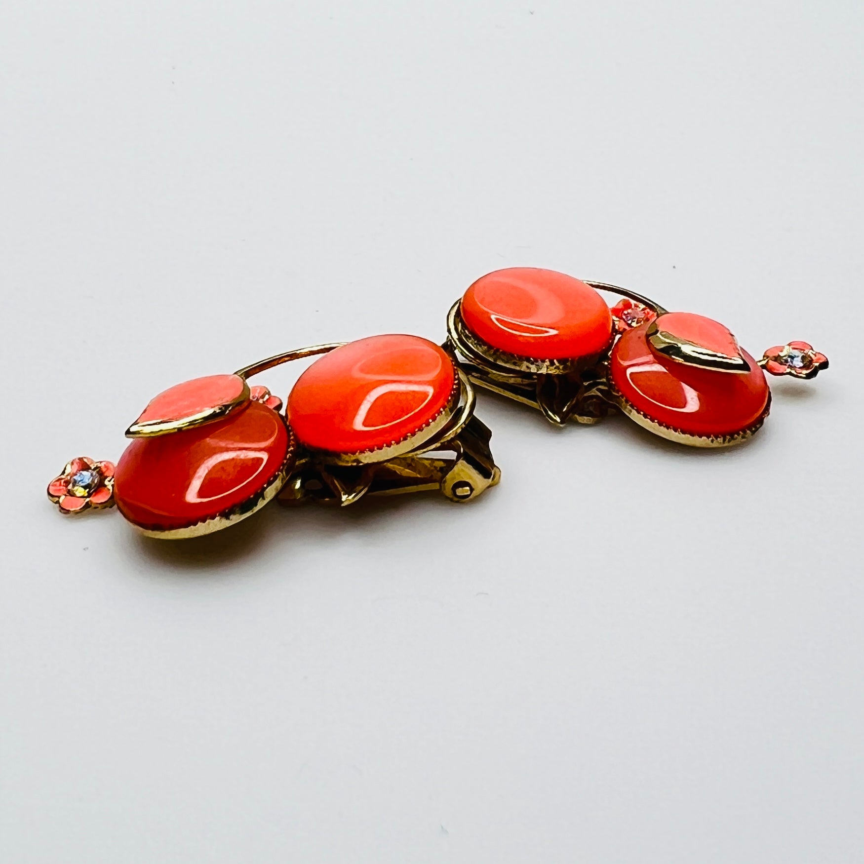 Close-up orange moonglow cabochon enamel leaf rhinestone detail