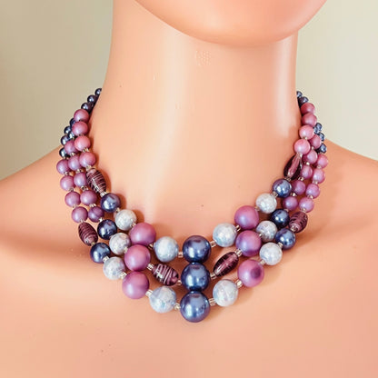 Layered pastel pink blue necklace worn on mannequin retro style