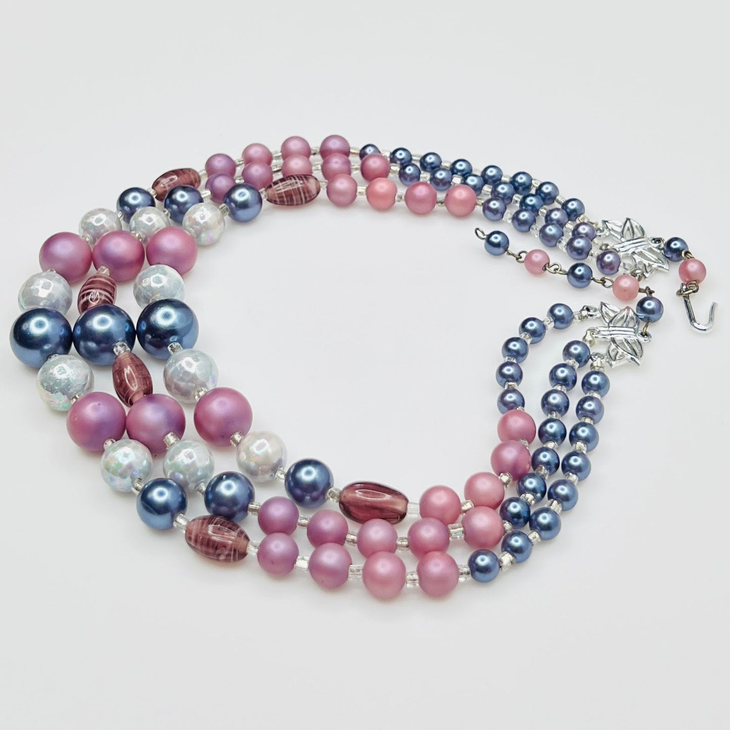 Multi strand necklace with blue pearls and pink beads close up
