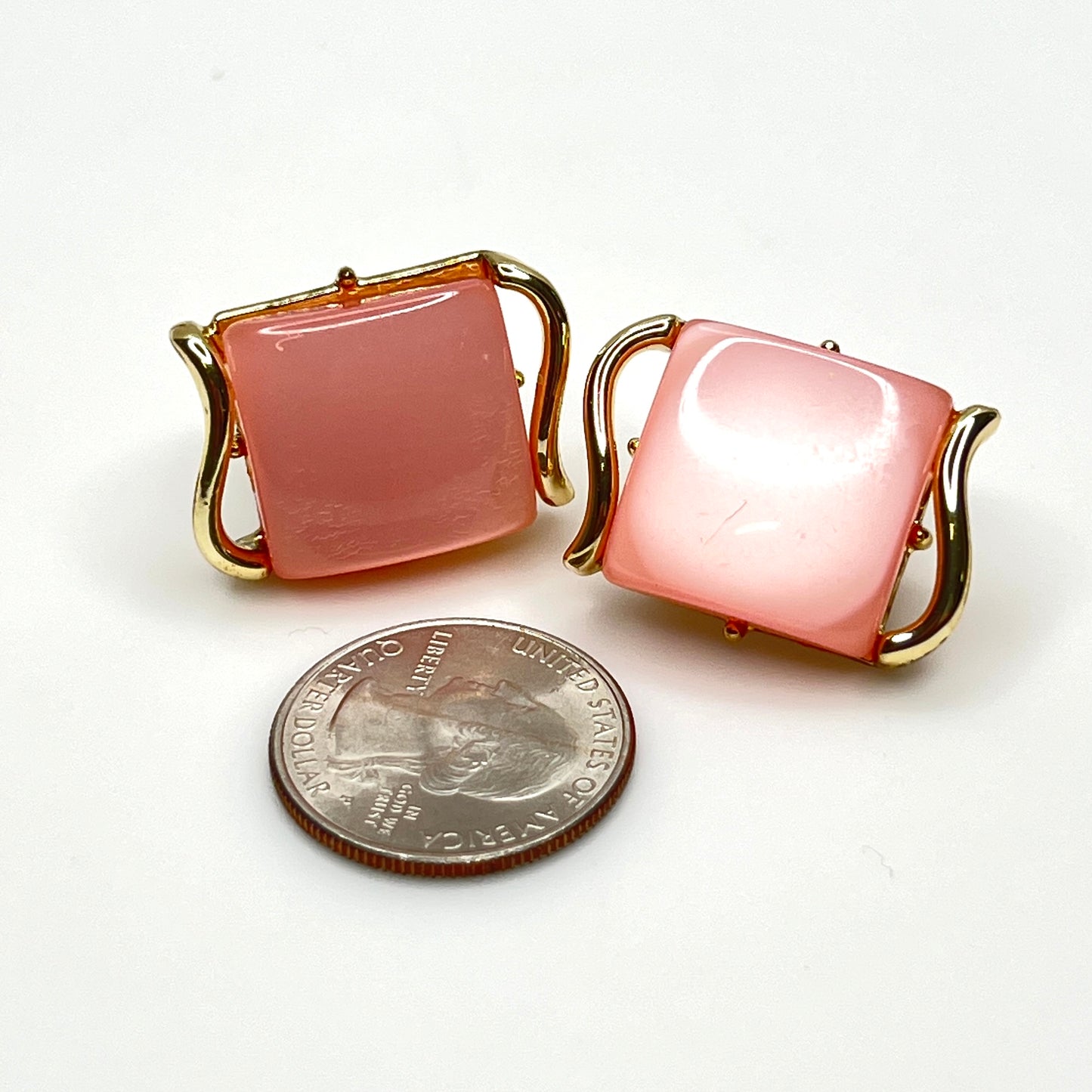 Mid-century pink Lucite clip-on earrings with quarter for size reference