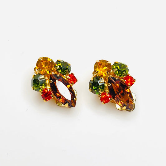 Vintage 1950s autumn rhinestone clip-on earrings with amber green and orange stones.