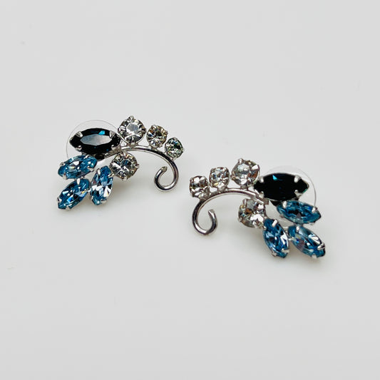 Vintage 1950s blue rhinestone floral stud earrings with silver tone setting