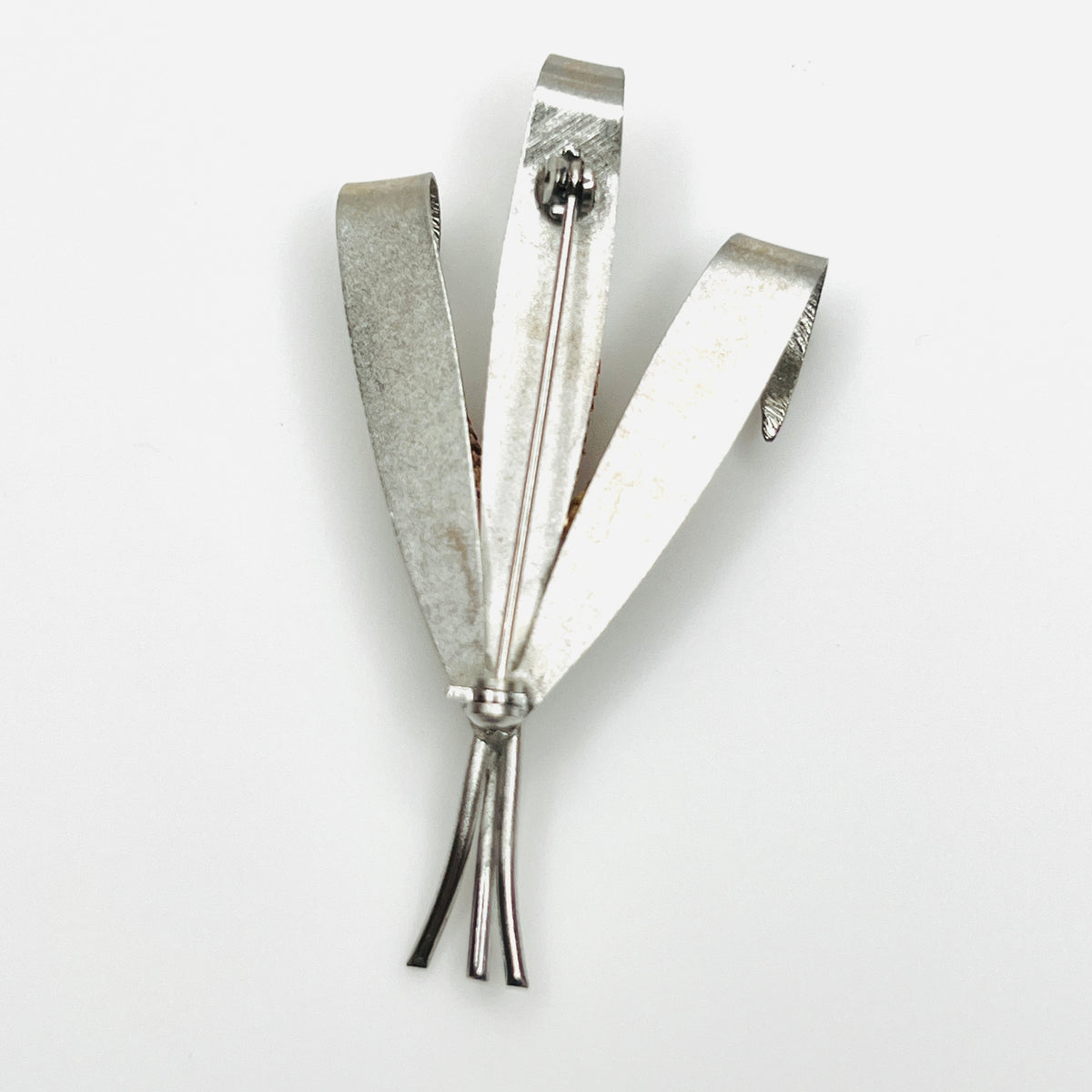 Back of unsigned 1950s silver-tone cattail brooch showing pin closure