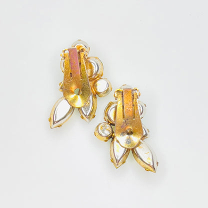 Back view of vintage gold tone clip-on earrings with secure clip closures.