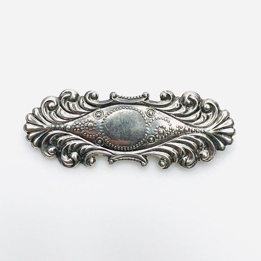 Vintage 1970s sterling silver bar brooch with ornate floral scrollwork and beaded detailing