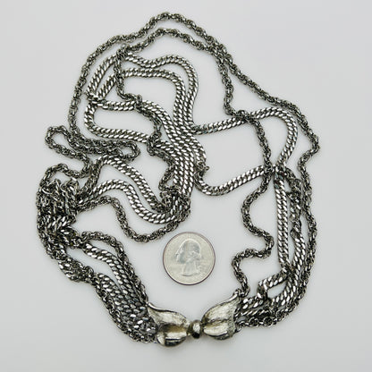 Multi chain necklace with bow clasp detail and mixed chain styles