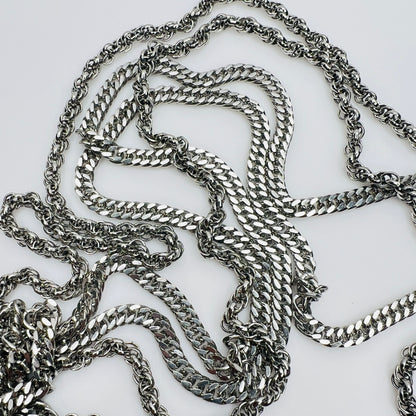 Multi chain necklace with bow clasp detail and mixed chain styles