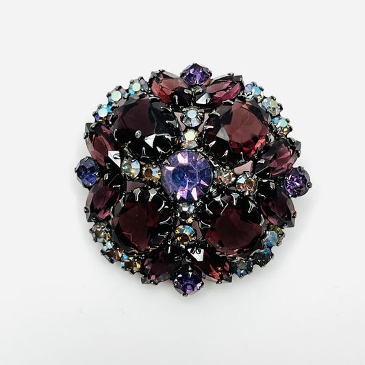 Juliana dome brooch with wine-colored oval and marquise rhinestones, violet stones, and aurora borealis accents.