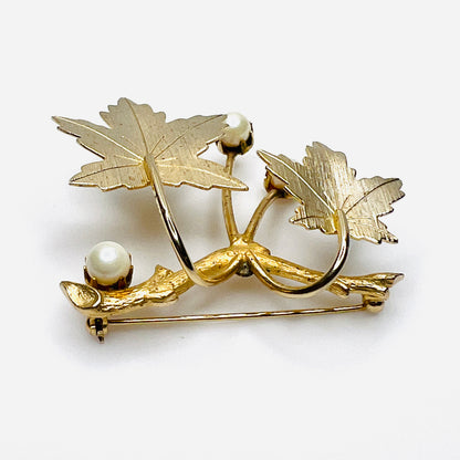 Reverse angle of Sarah Coventry maple leaf brooch showing textured leaves and dimensional construction