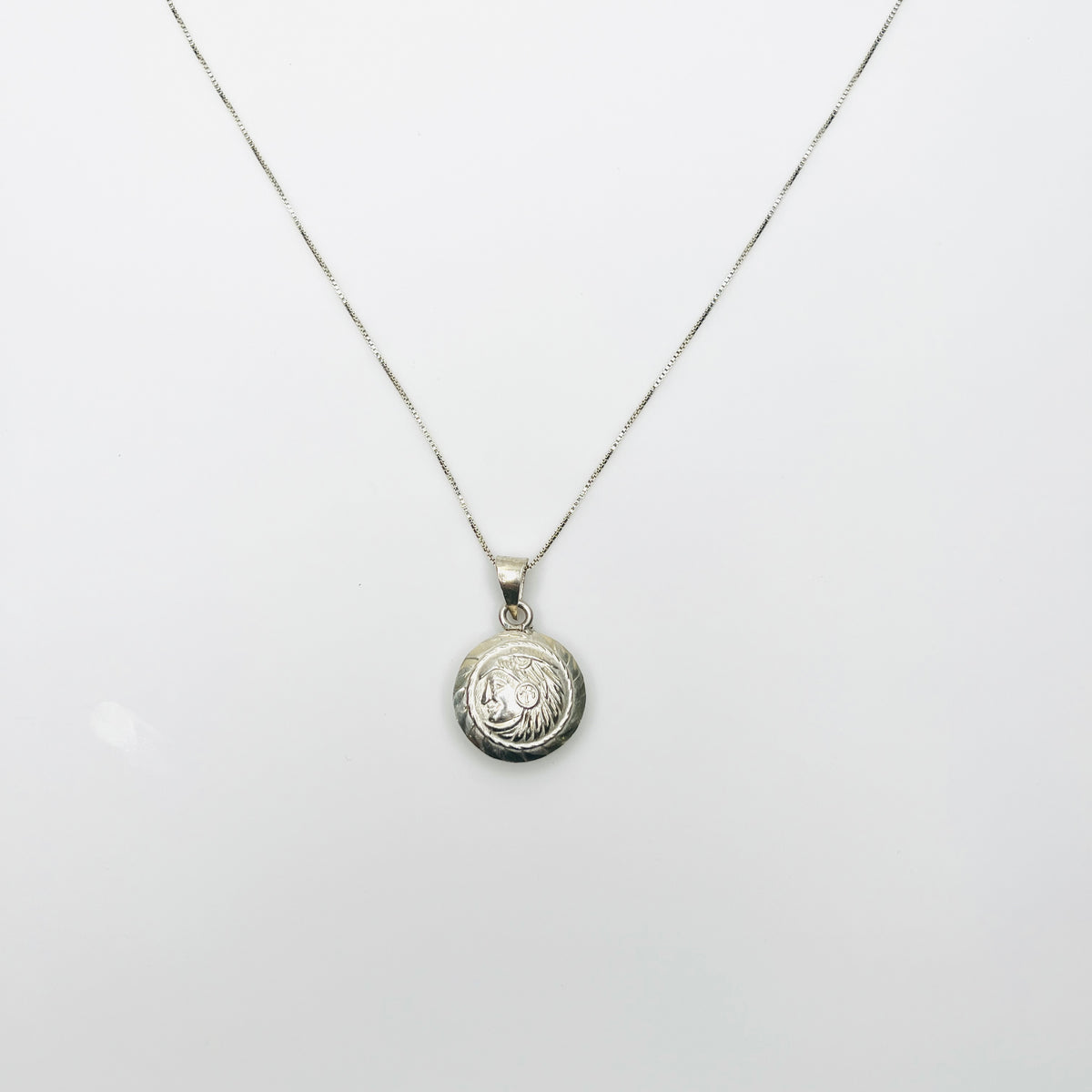 1960s silver Aztec pendant necklace with round Tonatiuh sun god design