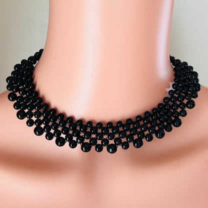Vintage black glass bead collar necklace on mannequin