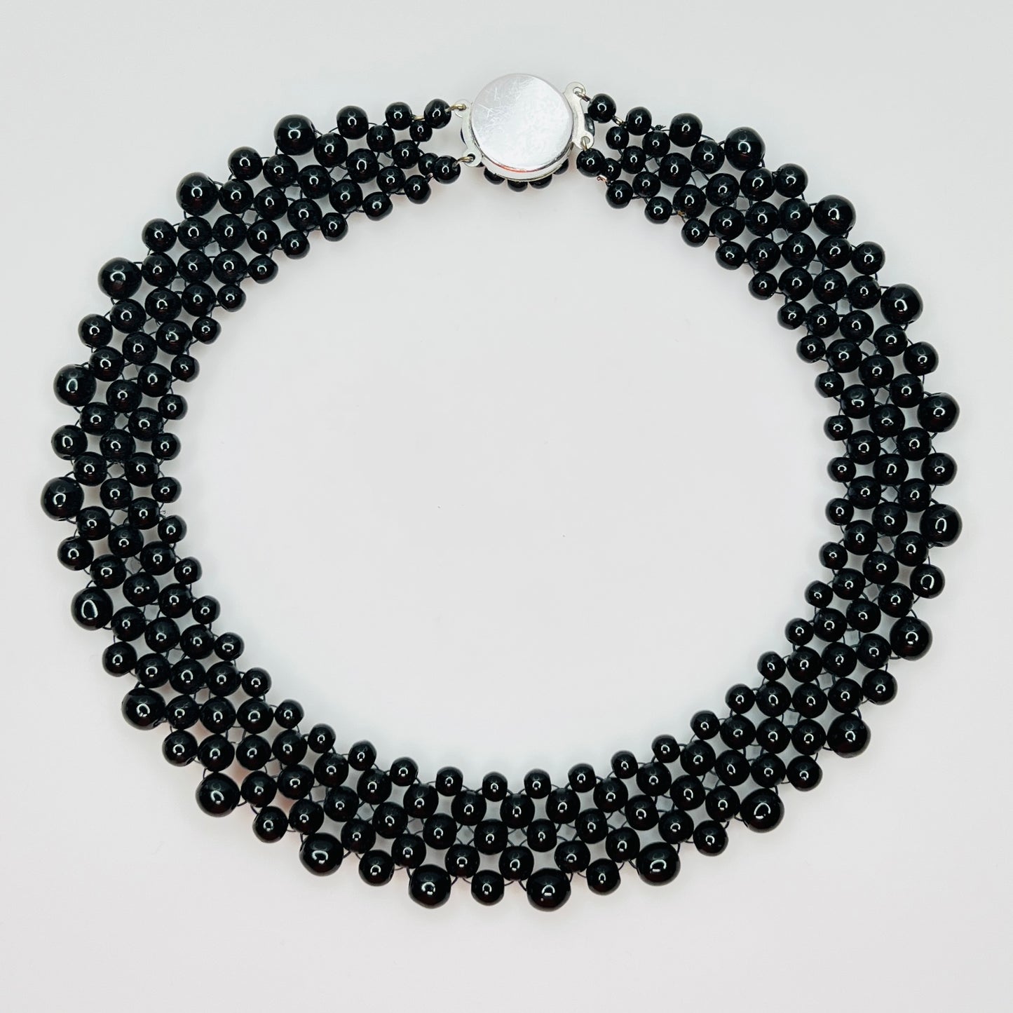 back view of multi strand black beaded collar necklace