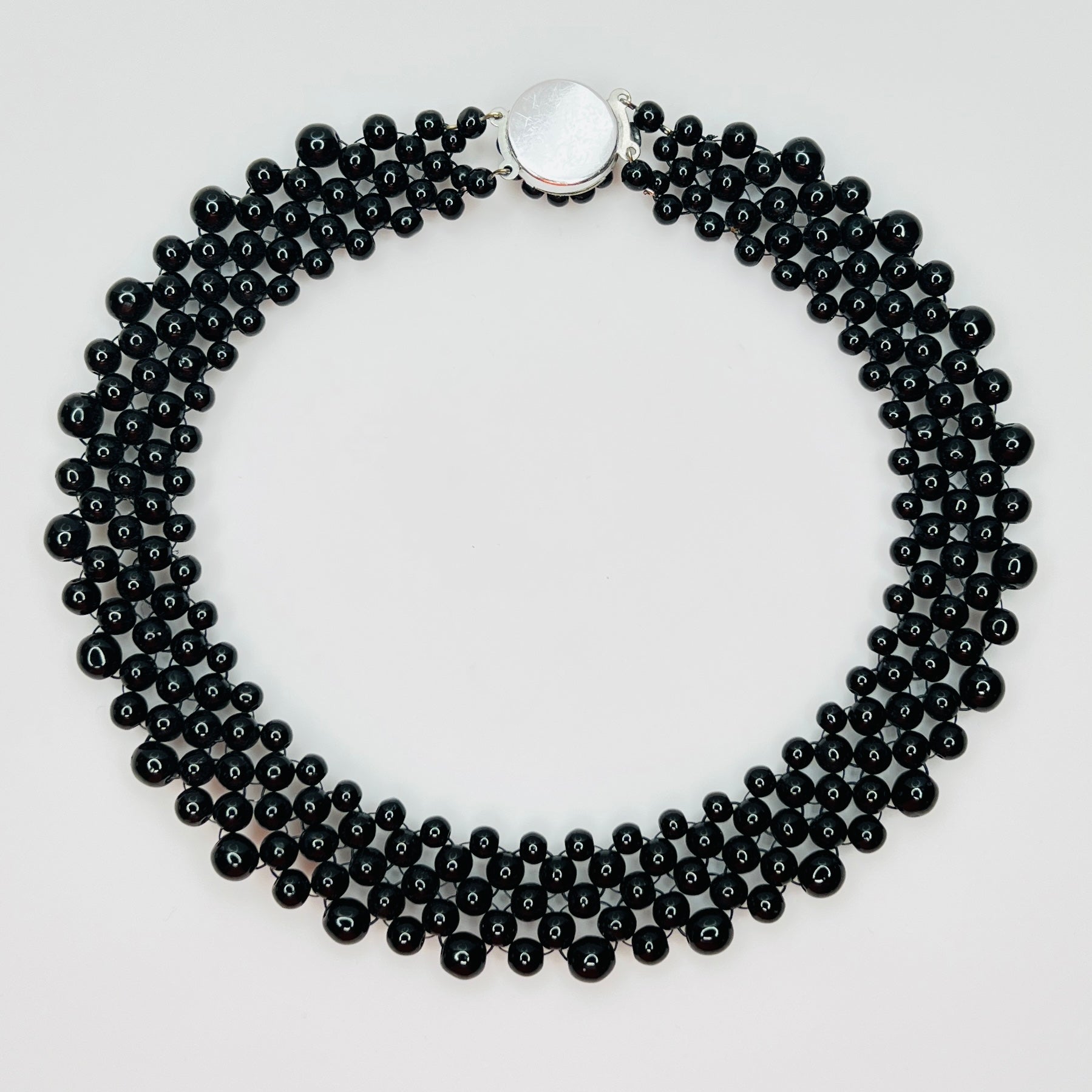 back view of multi strand black beaded collar necklace