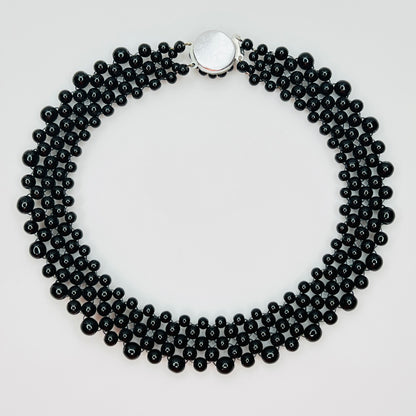 back view of multi strand black beaded collar necklace