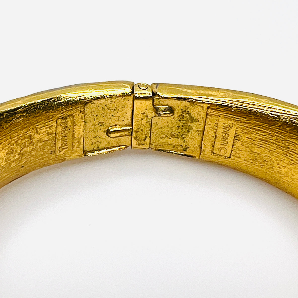 Crown Trifari hallmark and copyright mark inside vintage gold tone bracelet