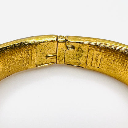 Crown Trifari hallmark and copyright mark inside vintage gold tone bracelet