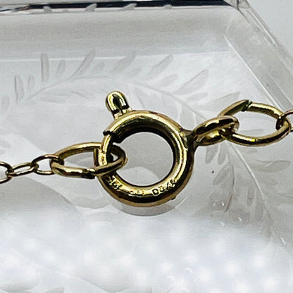 Detail of 12K gold filled spring ring clasp on vintage necklace