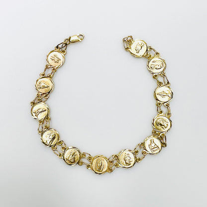 Vintage 14K yellow gold Catholic saints medal panel bracelet with religious motifs