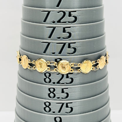 Vintage 14K gold Catholic saints medal bracelet measuring approximately 8 inches