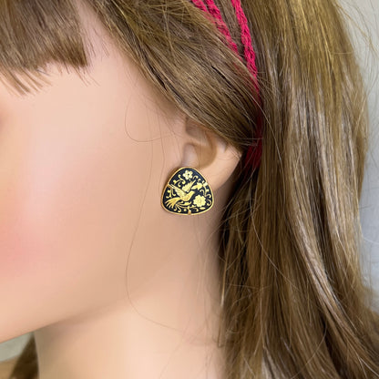 Damascene earrings worn on ear black gold bird design