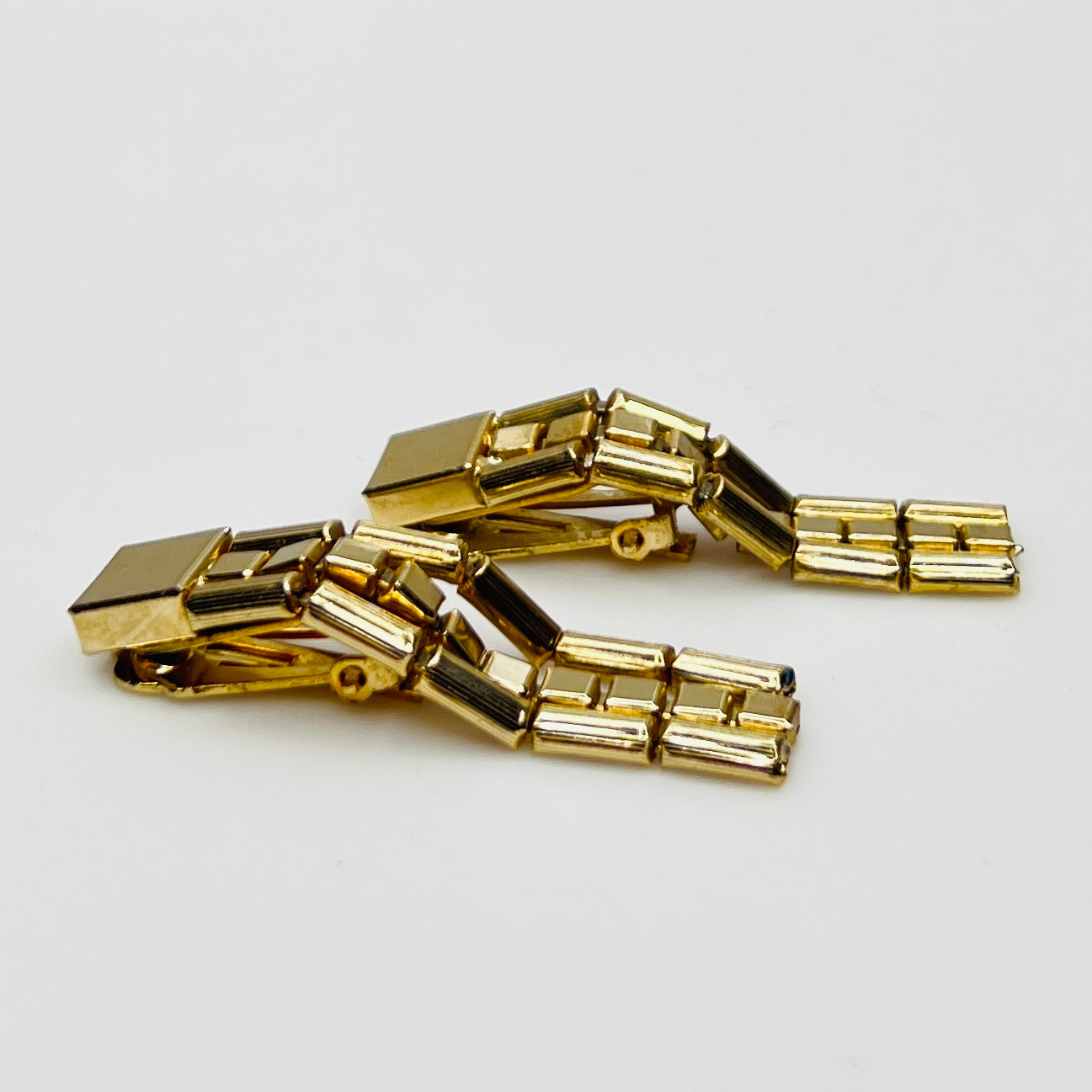 Side view articulated chain dangle earrings vintage gold tone