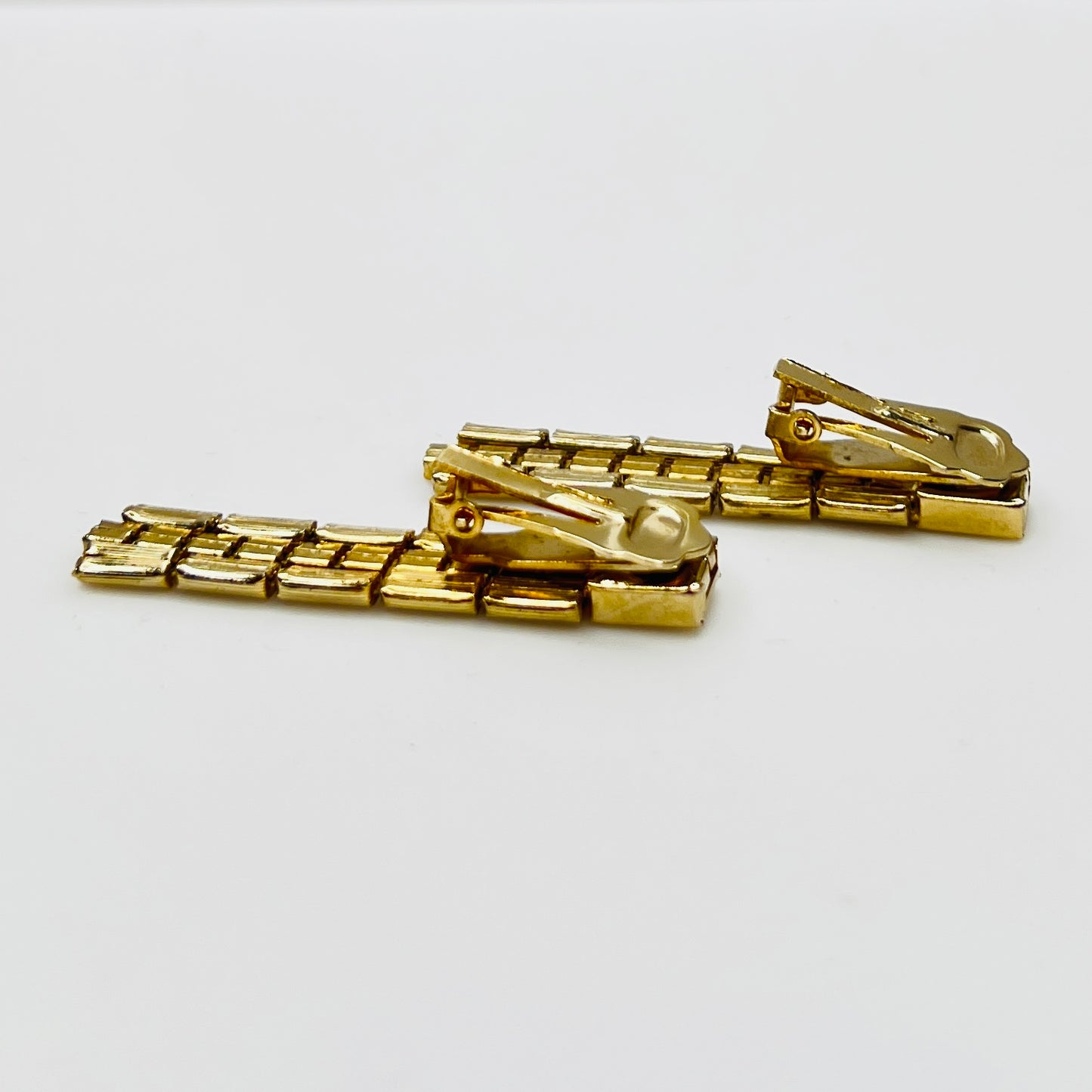 Side view articulated chain dangle earrings vintage gold tone
