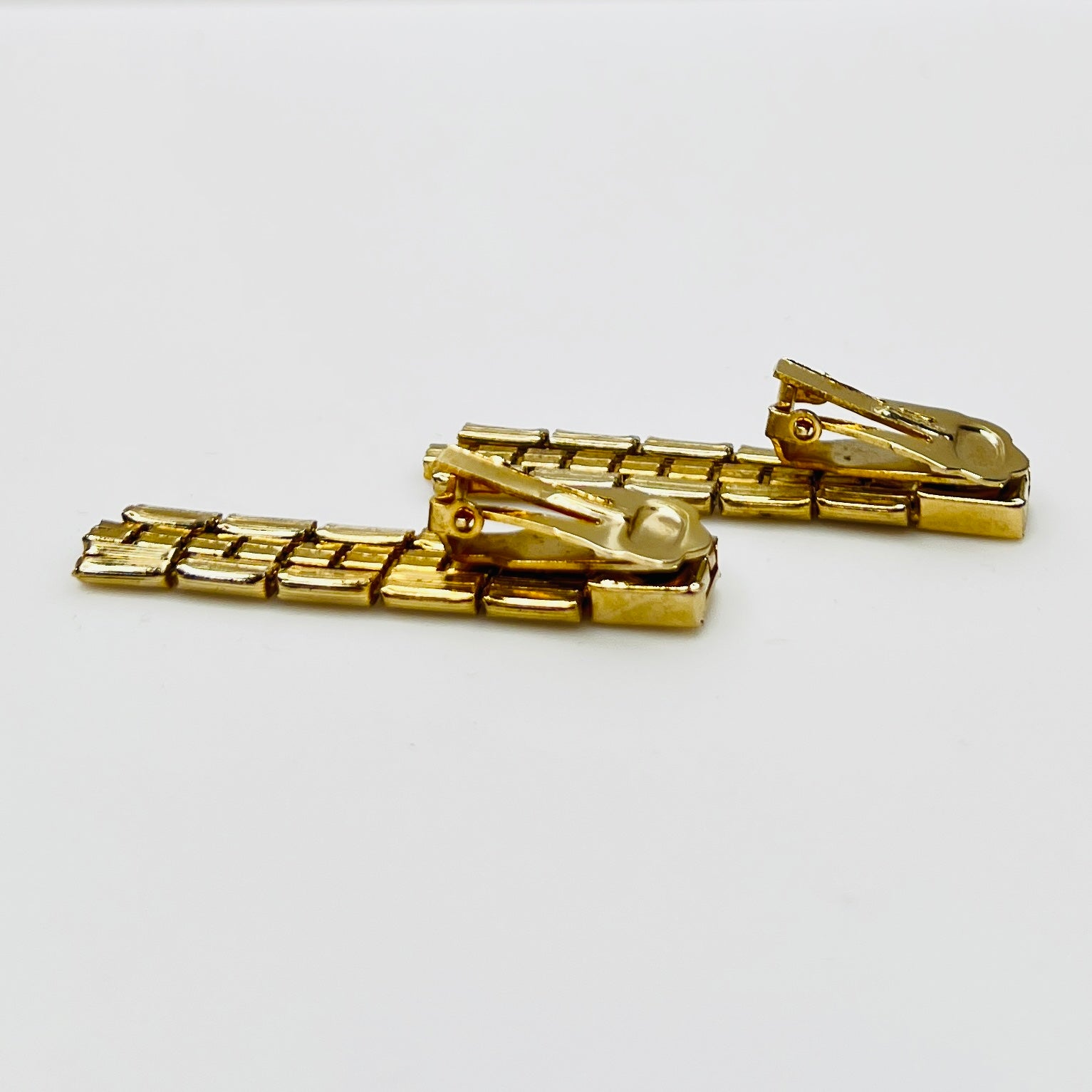 Side view articulated chain dangle earrings vintage gold tone