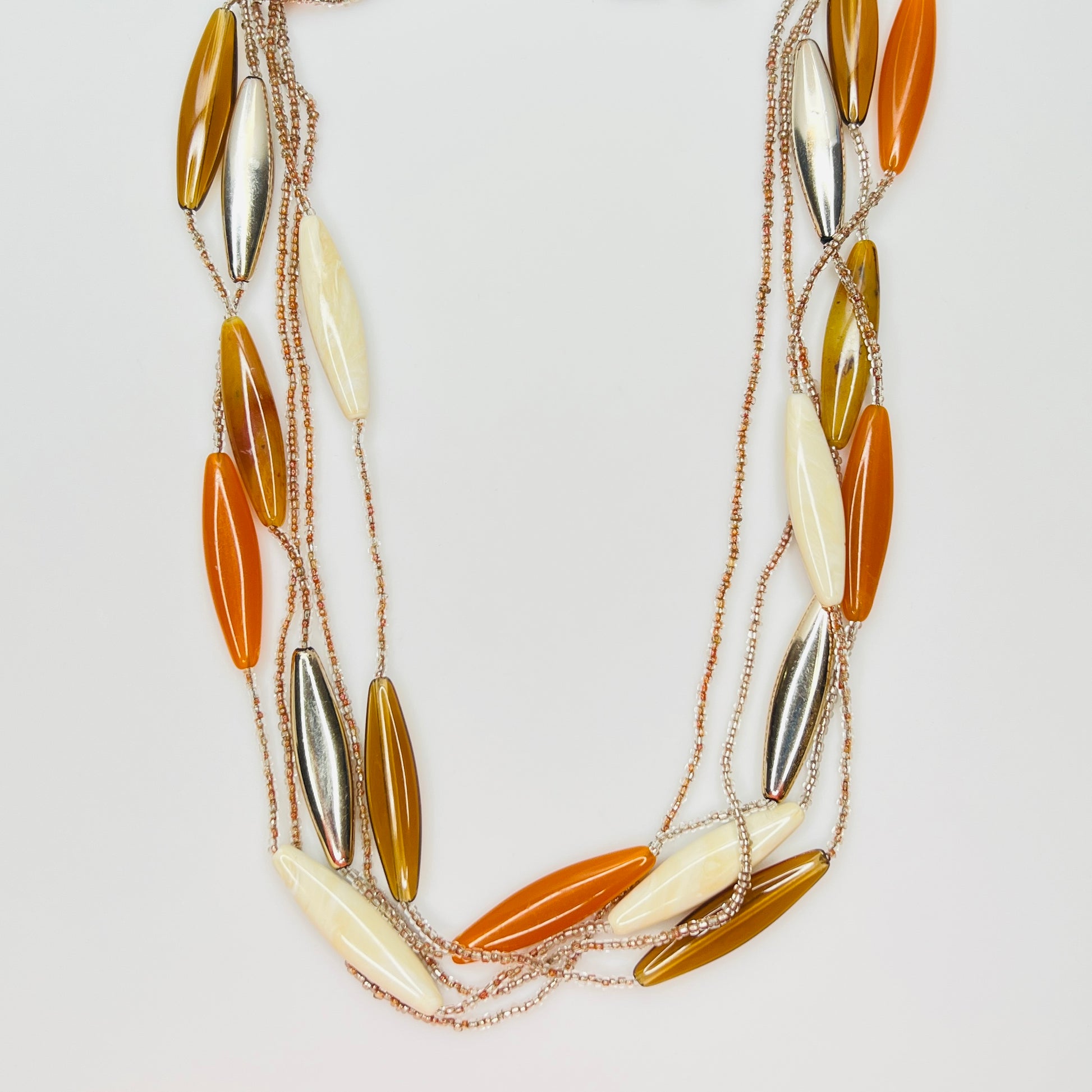 Vintage lucite multi strand necklace with amber and ivory beads
