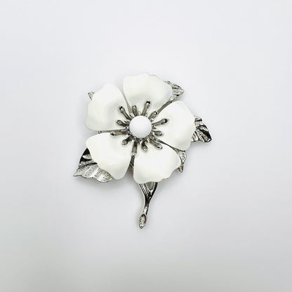 Vintage 1970s Sarah Coventry white enamel flower brooch with silver-tone leaves and stem